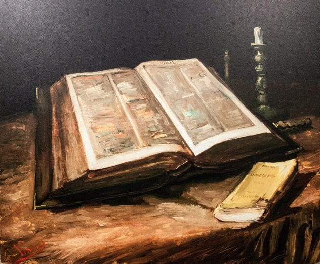 Painting of an open Bible with a little b book and candlesticks